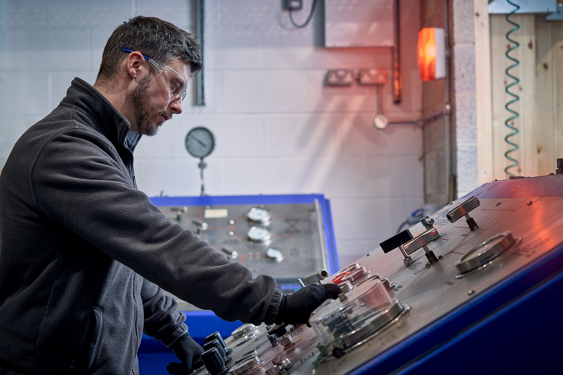 Colson Valves engineer operating valve pressure testing rig during quality control inspection at Rotherham facility